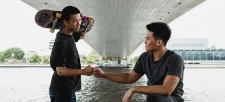skateboard guys underpass doing a fist bump non sexual touch and porn recovery